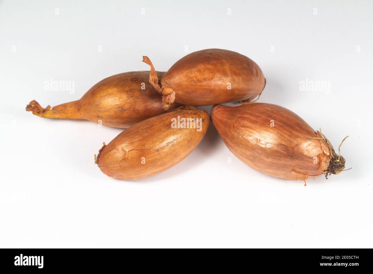 Fresh raw shallots isolated on white background Stock Photo