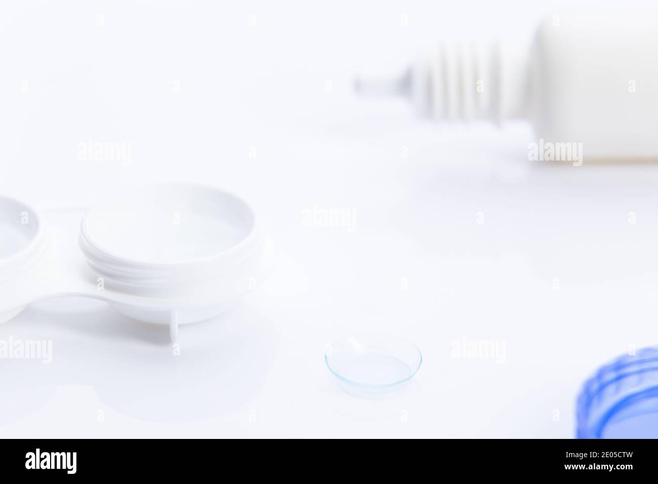 lenses and contact lens case on white background selective focus. Stock Photo