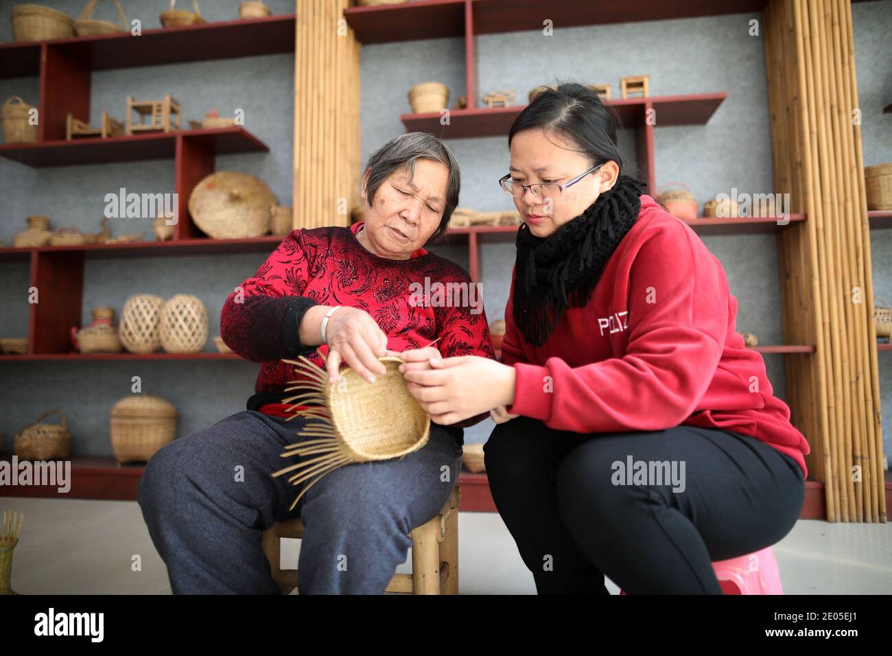 Gan Huiling is representative inheritor of municipal intangible cultural heritage project of bamboo weaving with 57 years experience in Foshan City, s Stock Photo