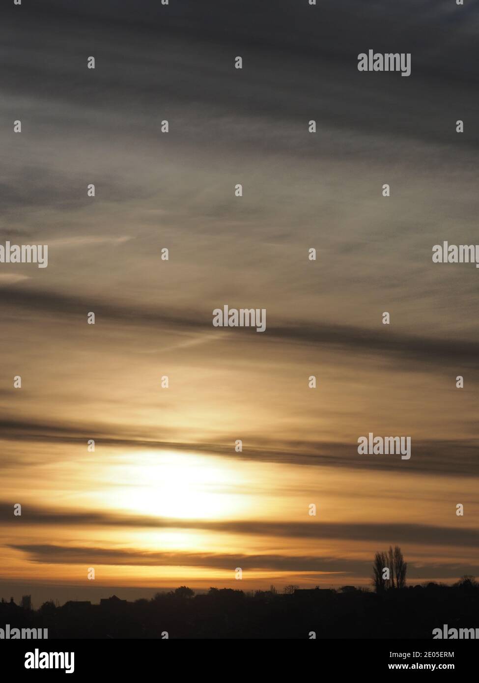 Minster on Sea, Kent, UK. 30th December, 2020. UK Weather: stunning colours at sunrise in Minster on Sea, Kent. Views over Sheppey.  Credit: James Bell/Alamy Live News Stock Photo