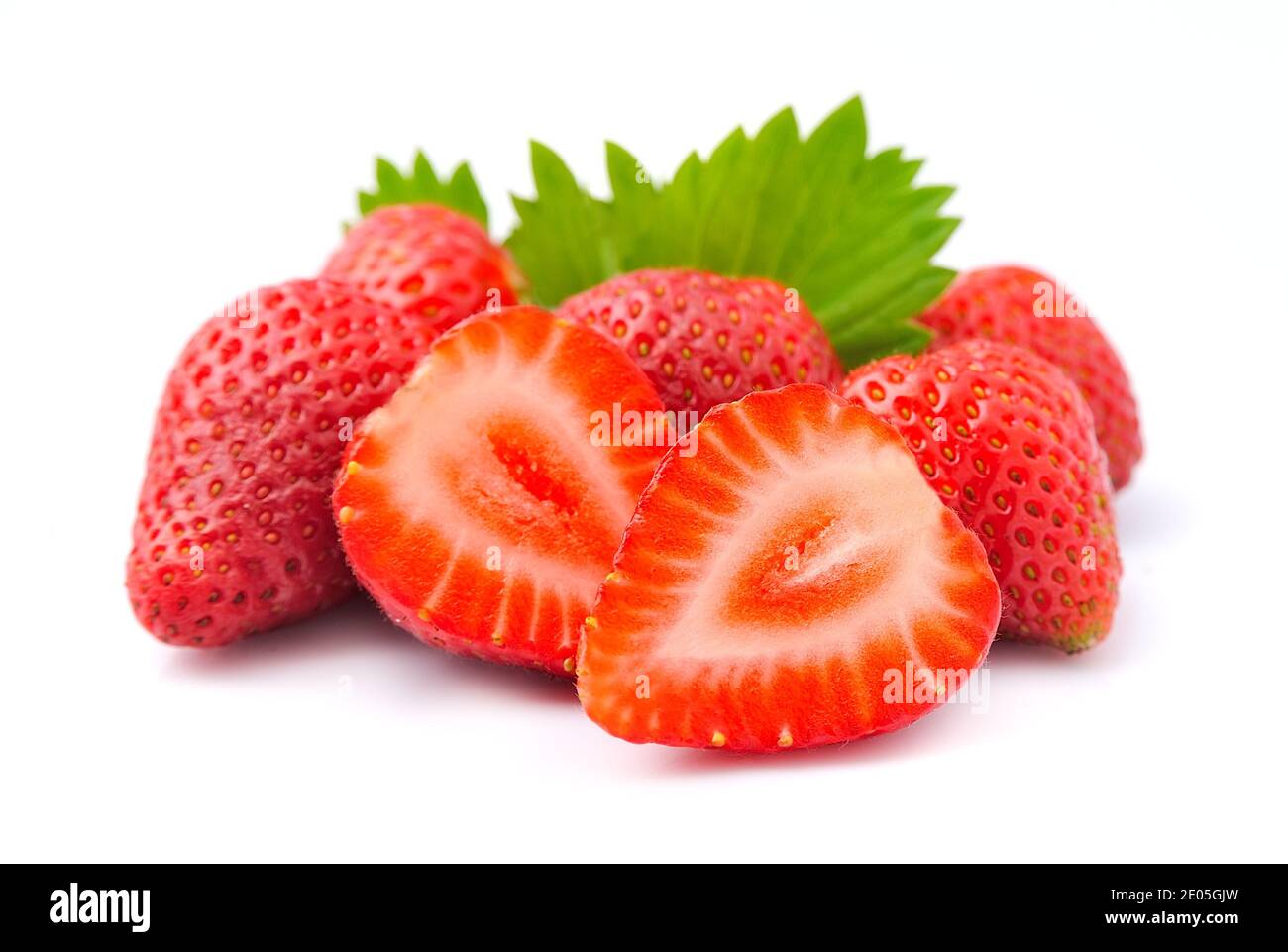 Ripe strawberry with leaves on white background Stock Photo - Alamy