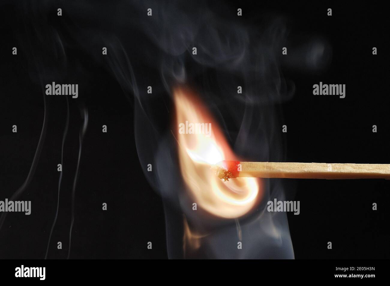 match ignited with hot orange flame with black background Stock Photo ...