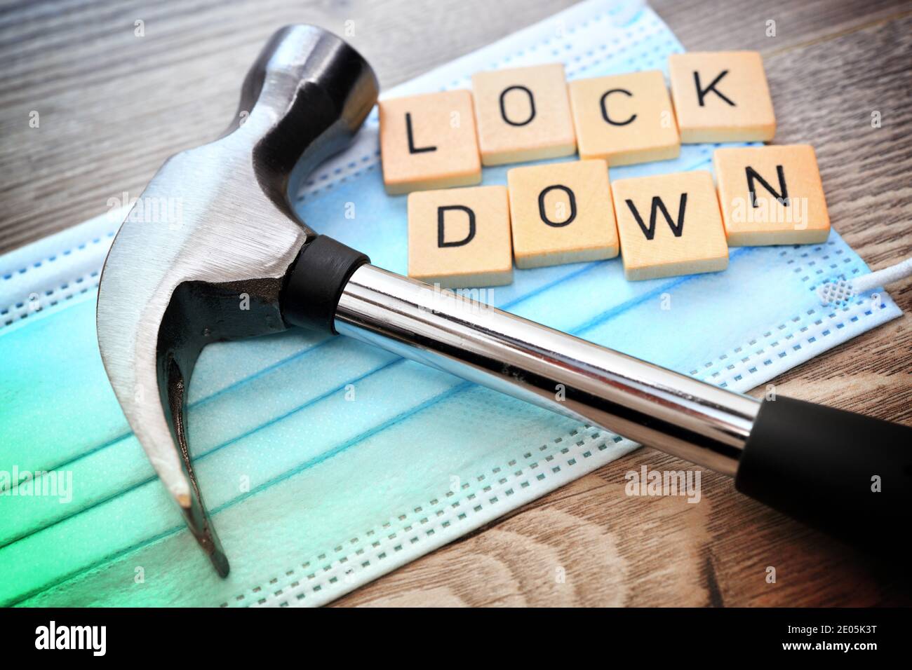 Hammer On Face Mask, Corona Lockdown Stock Photo