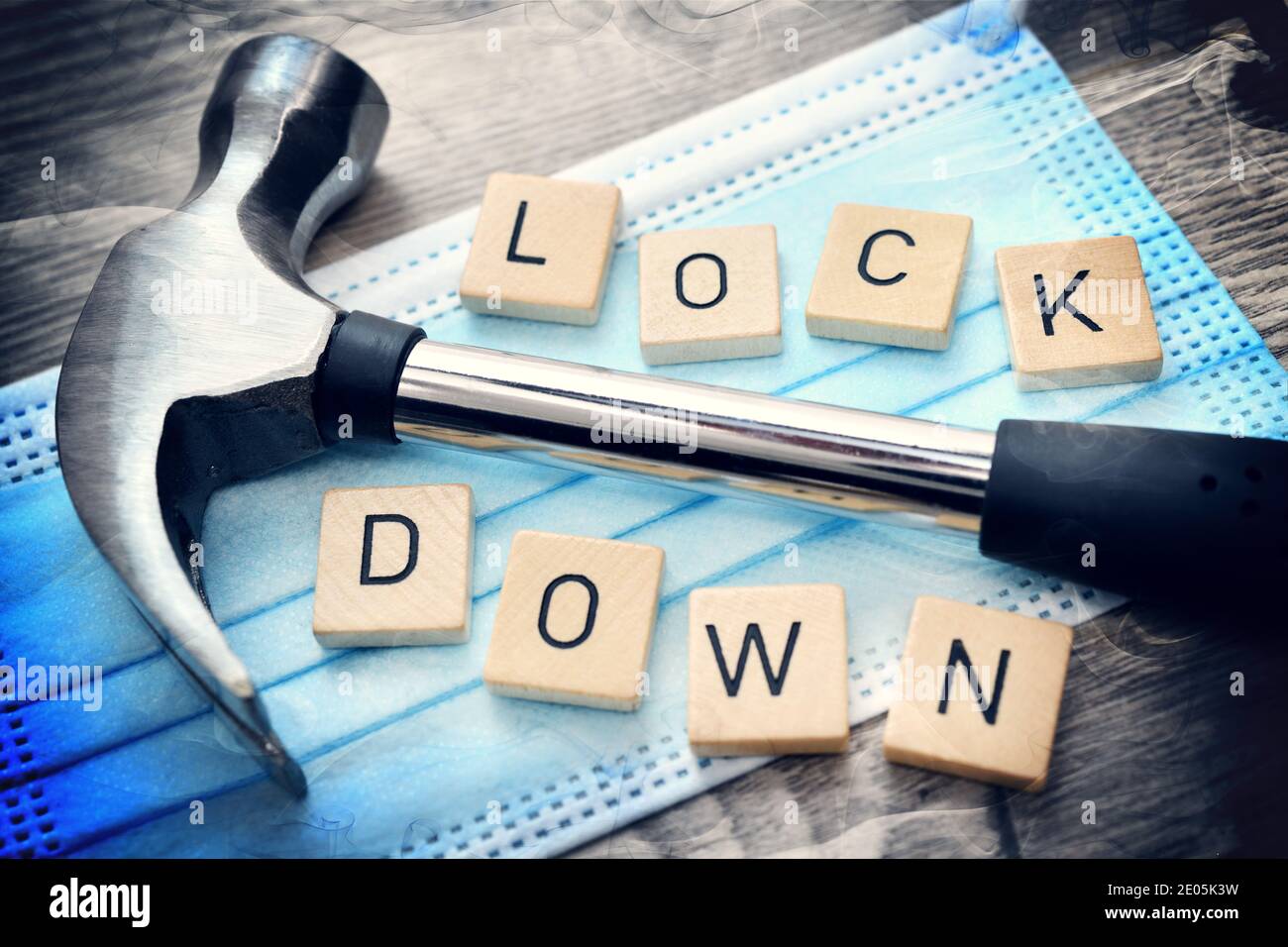 Hammer On Face Mask, Corona Lockdown Stock Photo