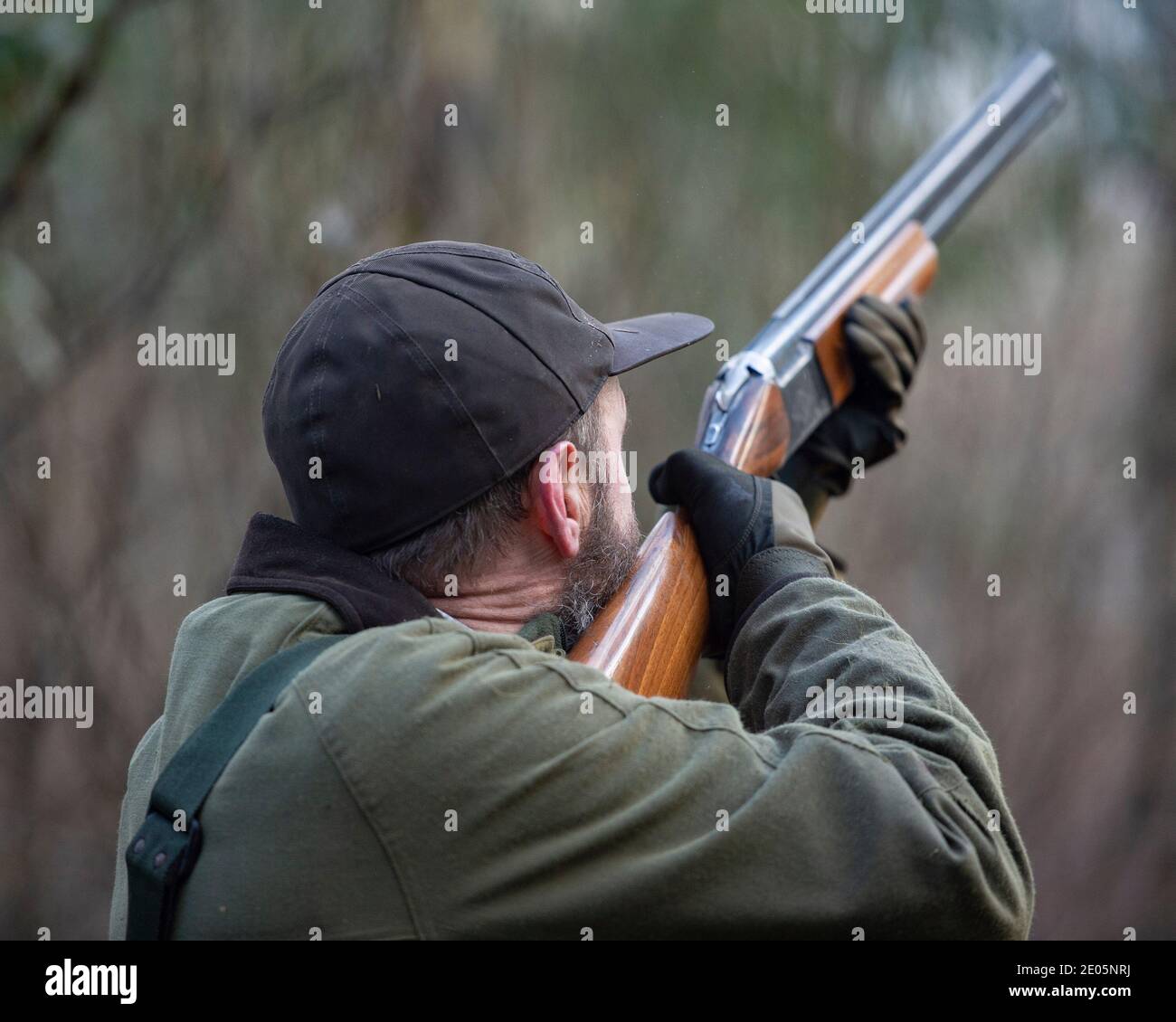 man shooting with shotgun Stock Photo