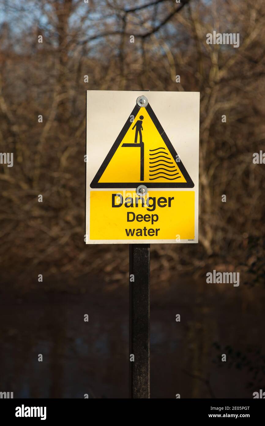 Danger Deep Water warning sign at River Wey, Weybridge, Surrey, UK