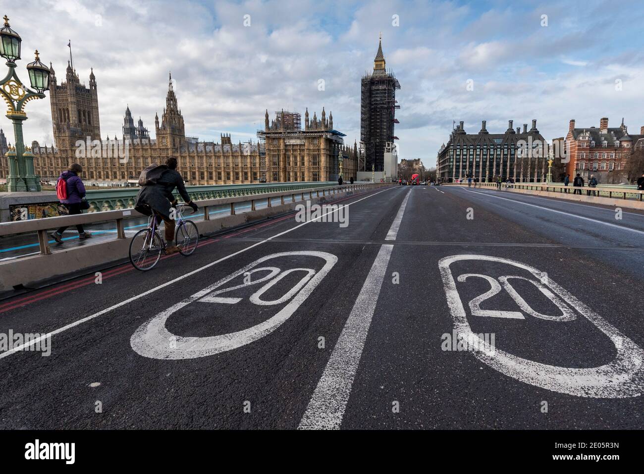 London, UK.  30 December 2020. The Houses of Parliament stand behind a pair of 20 miles per hour speed limit signs on the road on Westminster Bridge which, together, show the year 2020.  As 2020 draws to a close, MPs are due to ratify the UK/EU trade deal in Parliament today.  At the same time, the UK government is trying to tackle the effects of the record levels of coronavirus cases which may require an increase in national tier alert levels.  Credit: Stephen Chung / Alamy Live News Stock Photo