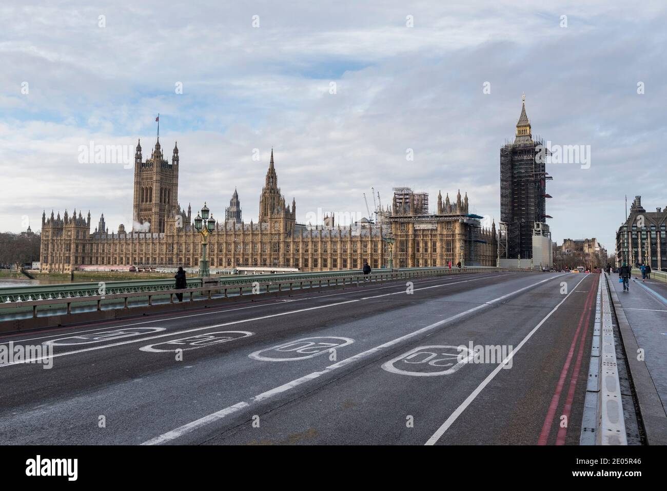 London, UK.  30 December 2020. The Houses of Parliament stand behind pairs of 20 miles per hour speed limit signs on the road on Westminster Bridge which, together, show the year 2020.  As 2020 draws to a close, MPs are due to ratify the UK/EU trade deal in Parliament today.  At the same time, the UK government is trying to tackle the effects of the record levels of coronavirus cases which may require an increase in national tier alert levels.  Credit: Stephen Chung / Alamy Live News Stock Photo
