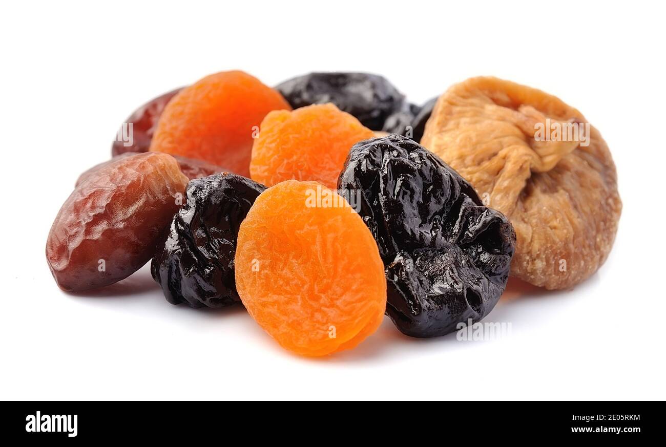 Dried fruits on white backgrounds. Prunes, apricots, figs and dates