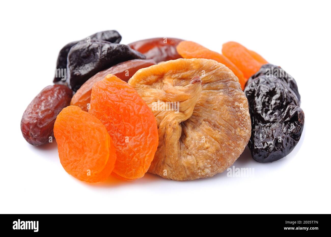 Mix of dried fruits isolated on white backgrounds.Heap of dried plums