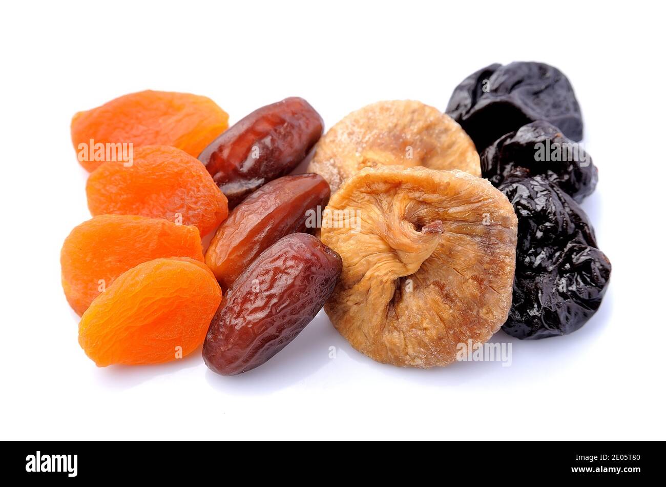 Mix of dried fruits isolated on white backgrounds..Heap of dried plums