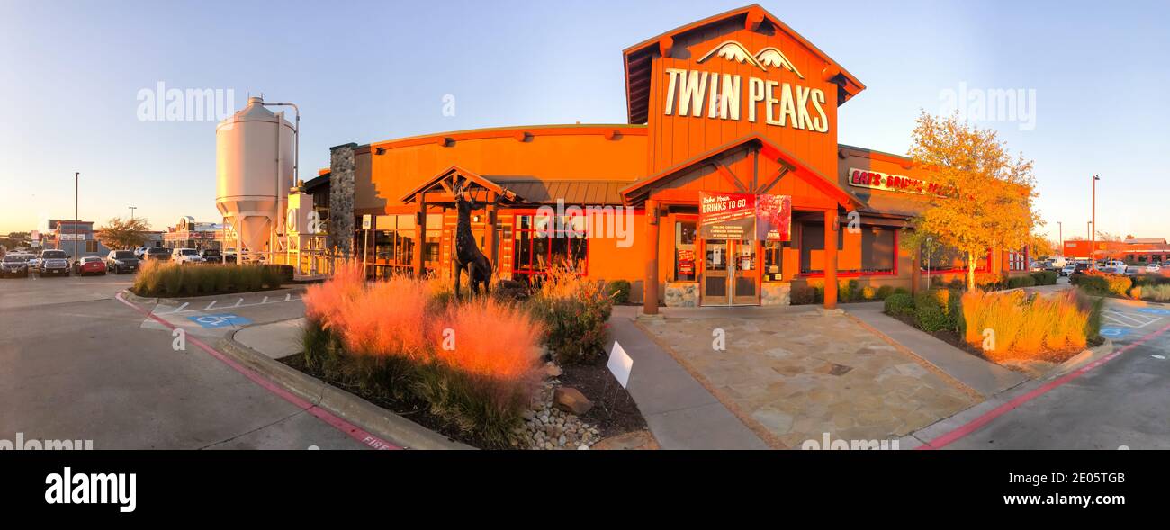 IRVING, TX, USA-DEC 6, 2020: Panorama view entrance to Twin Peaks restaurant chain at sunset. A breastaurant, sports bar grill with scratch food, ice Stock Photo