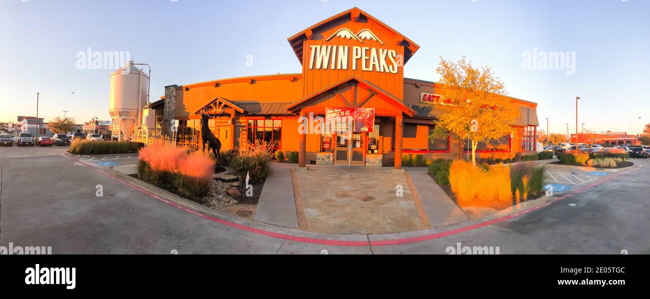 IRVING, TX, USA-DEC 6, 2020: Panorama view entrance to Twin Peaks restaurant chain at sunset. A breastaurant, sports bar grill with scratch food, ice Stock Photo
