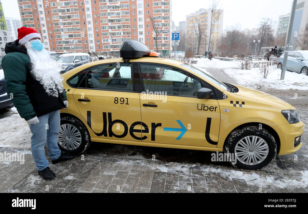 Moscow, Russia. 30th Dec, 2020. An Uber driver is dressed as 