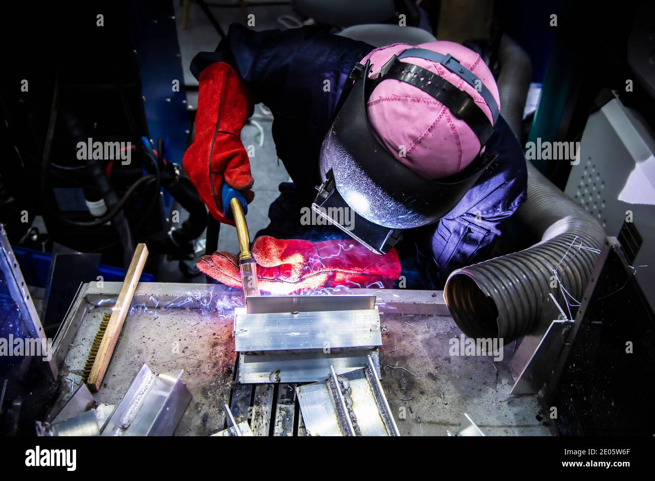 Welding steel with spread spark and lighting around. Stock Photo