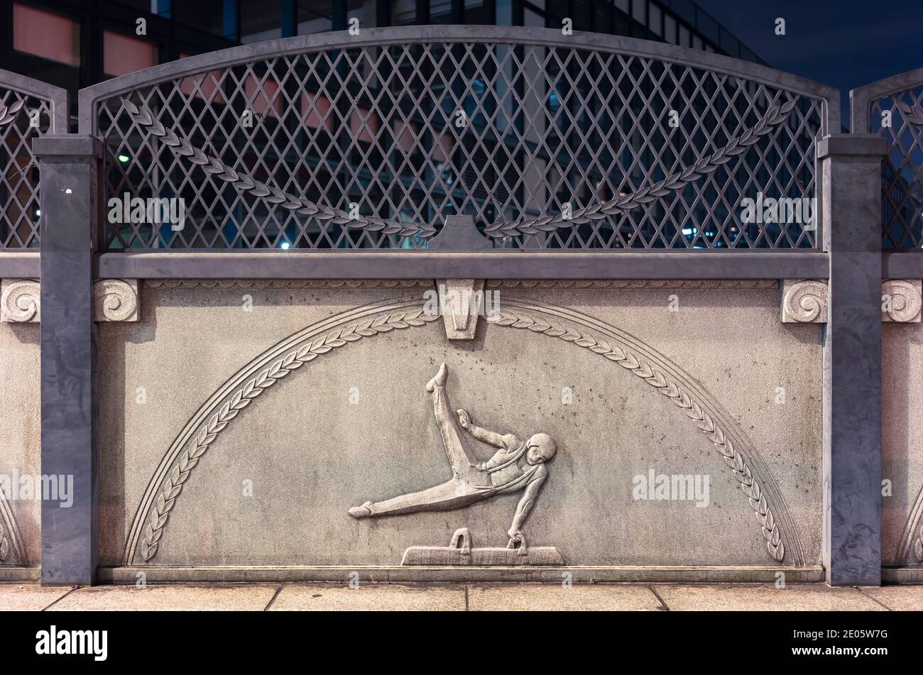 tokyo, japan - november 02 2020: Close up on a stone relief depicting an athlete practicing pommel horse on the Olympic Bridge of Harajuku named Gorin Stock Photo