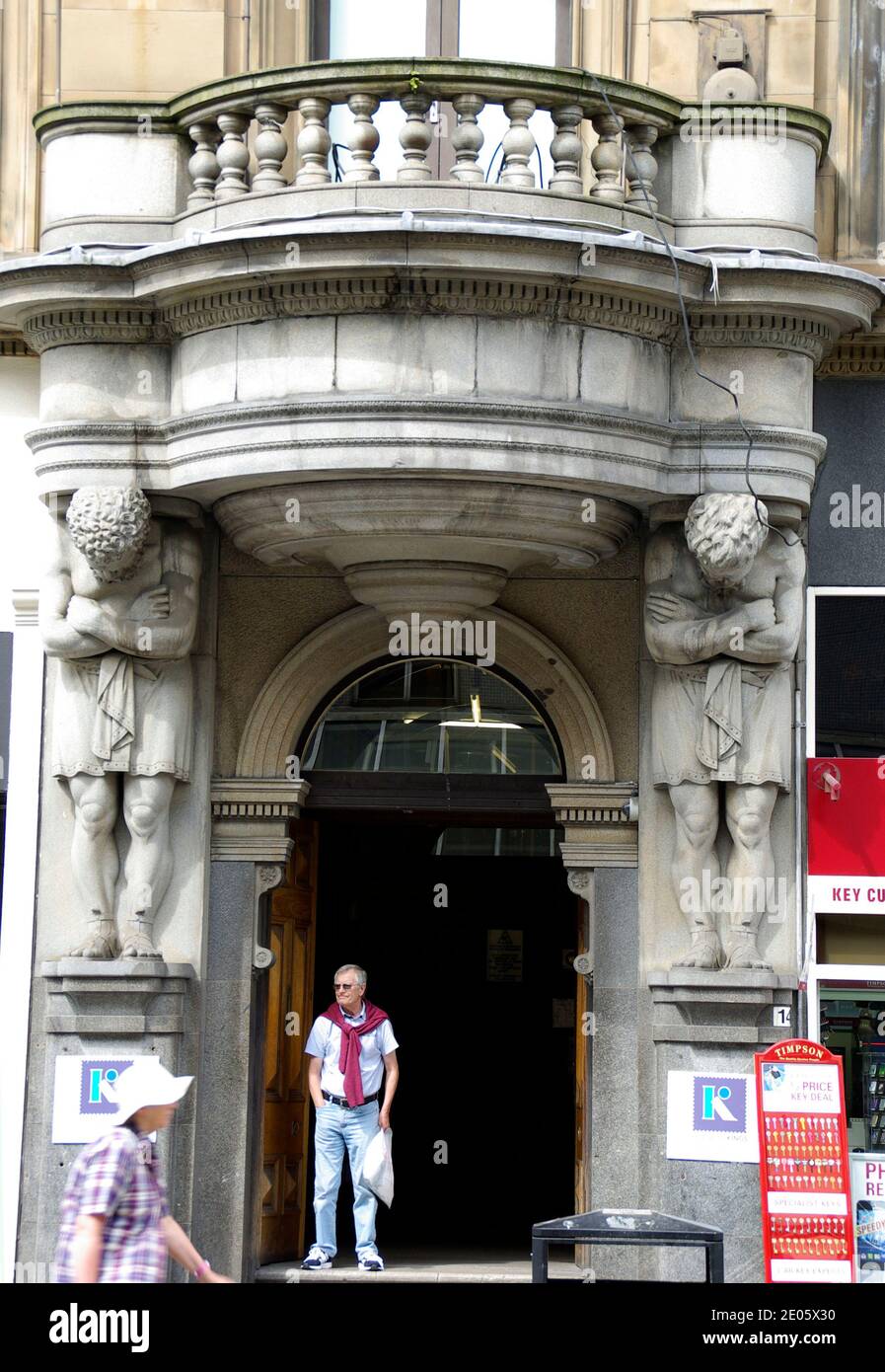 Atlantes at the entrance to the former Stewart and Macdonald building, Argyle Street Glasgow Stock Photo