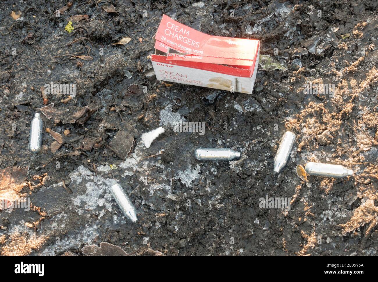 Discarded cream chargers or nitrous oxide cartridges used by substance
