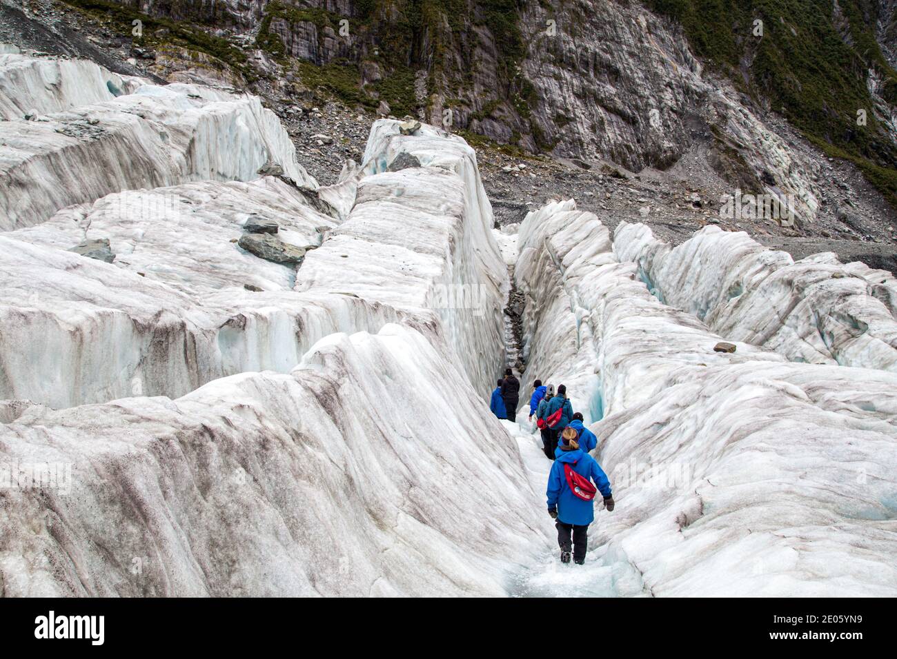 Tourists hiking on Franz Josef Glacier, New Zealand Stock Photo