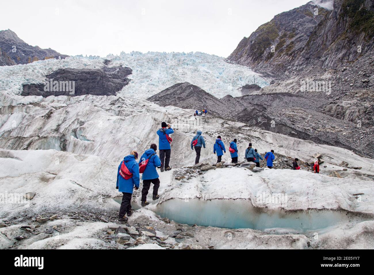 Tourists hiking on Franz Josef Glacier, New Zealand Stock Photo
