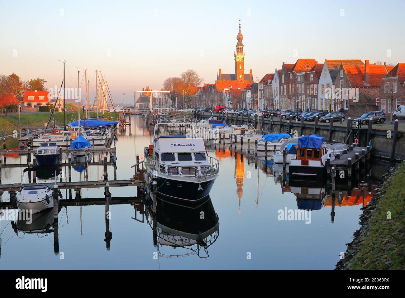 VEERE, NETHERLANDS - DECEMBER 10, 2020: The marina (harbor) and historic buildings with the clock tower of the Stadhuis (town hall) Stock Photo