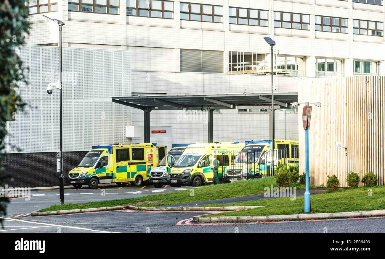 John Radcliffe Hospital Oxford, UK. December 30th 2020 Ambulances wait outside of the John Radcliffe Hospital. It has been reported in some areas of the country that patients are being cared for in the ambulances and there are patients out in the community that don't receive an ambulance response because there are none left to send. The country is ‘back in the eye of the storm', according to the head of the NHS, with the number of patients being treated for COVID19 in England's hospitals overtaking the peak back in April.Bridget Catterall/Alamy Live News Stock Photo