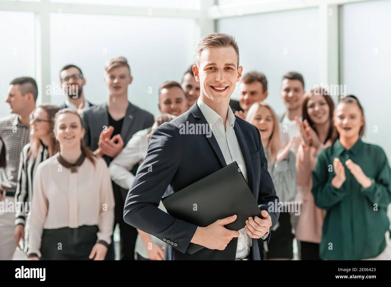 young project Manager standing in front of the working group Stock Photo
