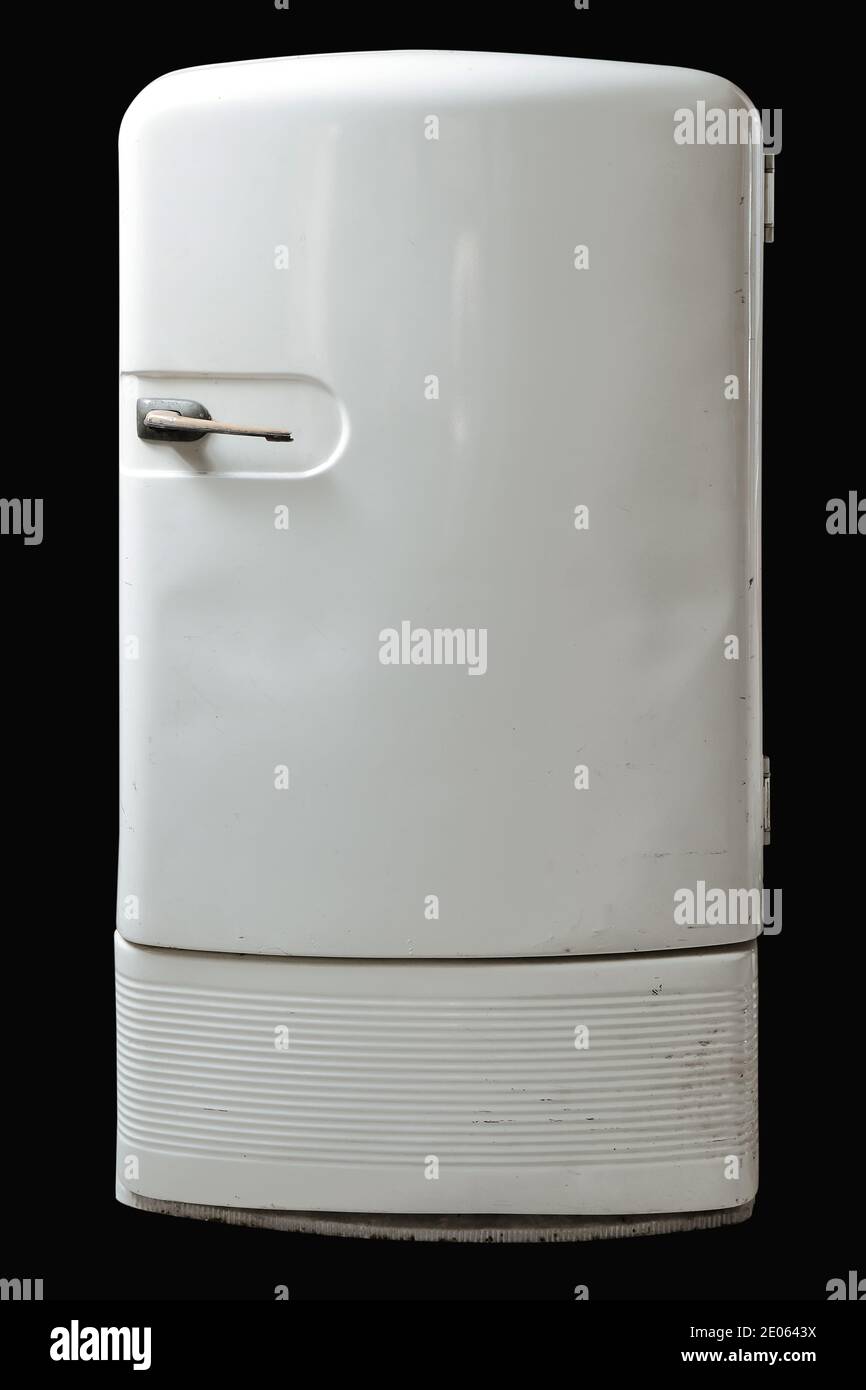 Retro refrigerator isolated on black background. Stock Photo