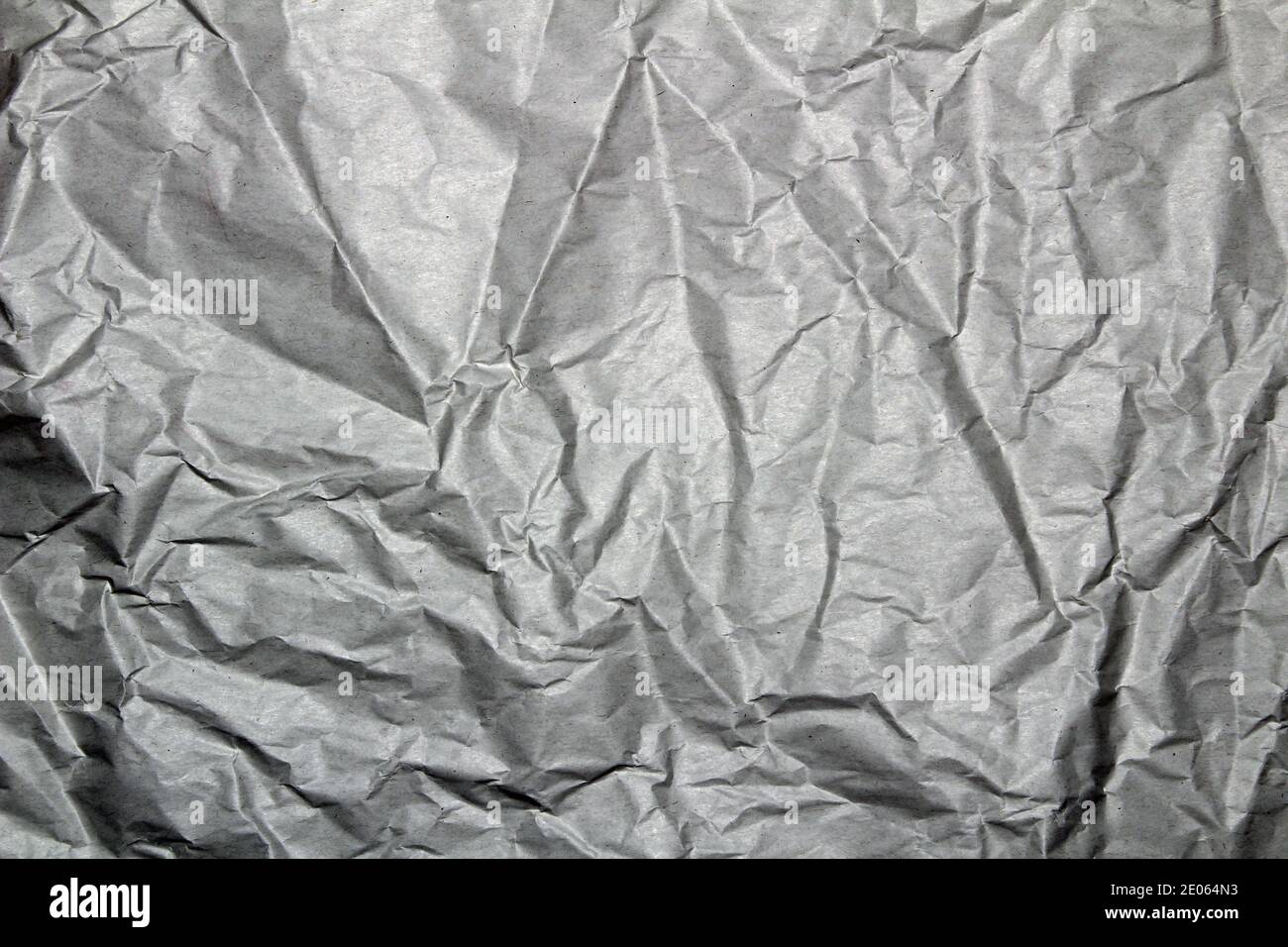 Crumpled grey silver textured plain background or wallpaper or webpage Stock Photo