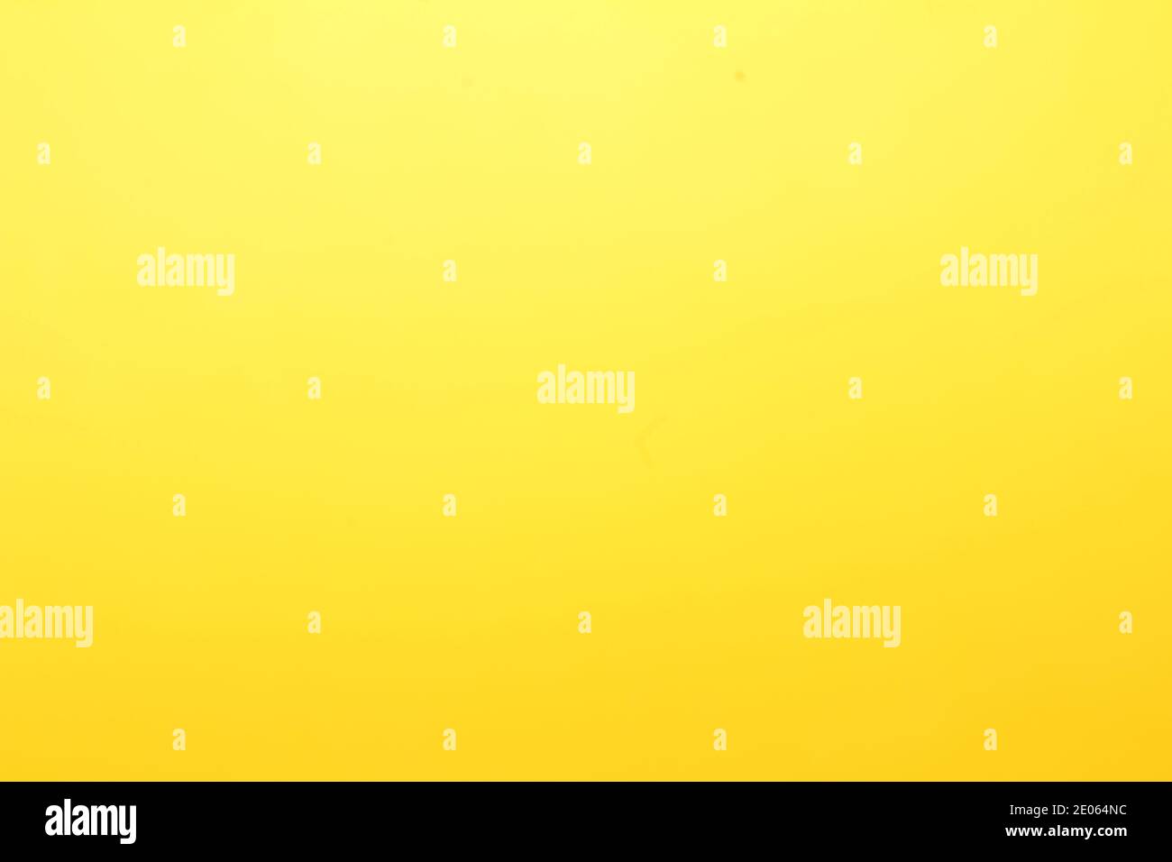 Graduated yellow glow plain background or wallpaper Stock Photo - Alamy