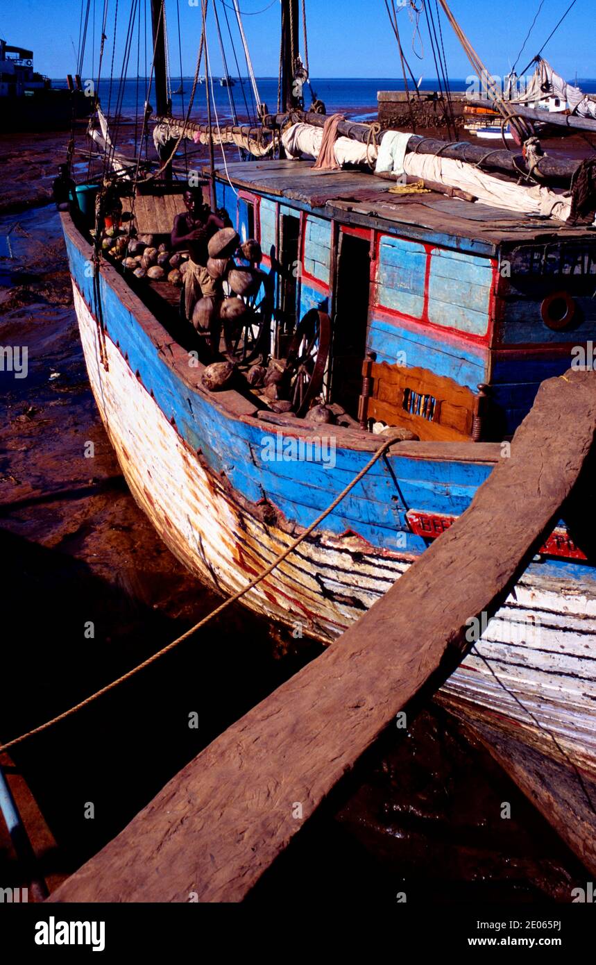 Gangplank, Gangway or Plank Leading to Old Wooden Dhow or Cargo Boat Moored in the Port, Harbor or Harbour of Mahajanga or Majunga Madagascar Stock Photo