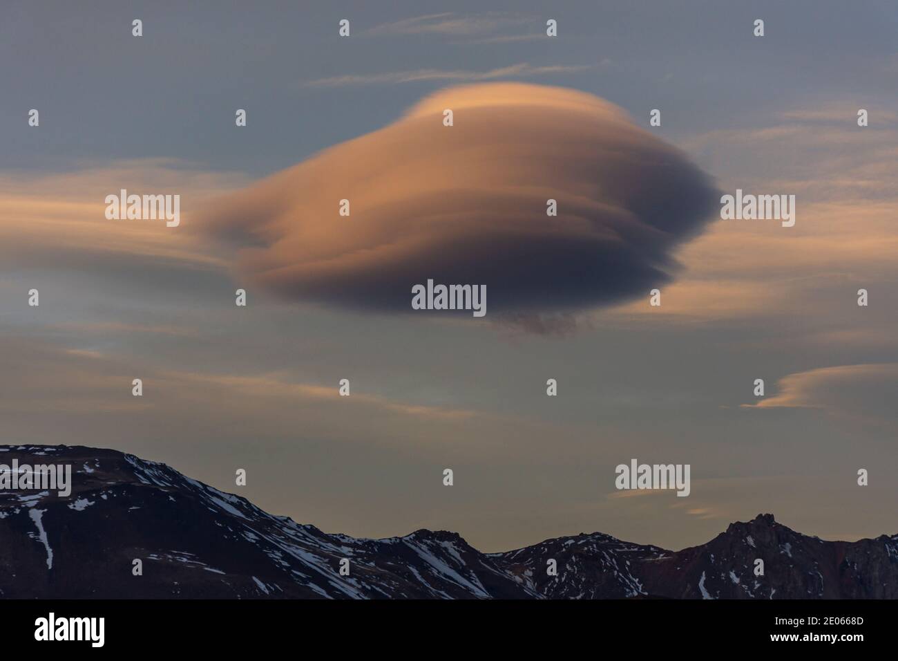 Lenticular clouds formation over the mountains during sunset in Esquel, Patagonia, Argentina Stock Photo