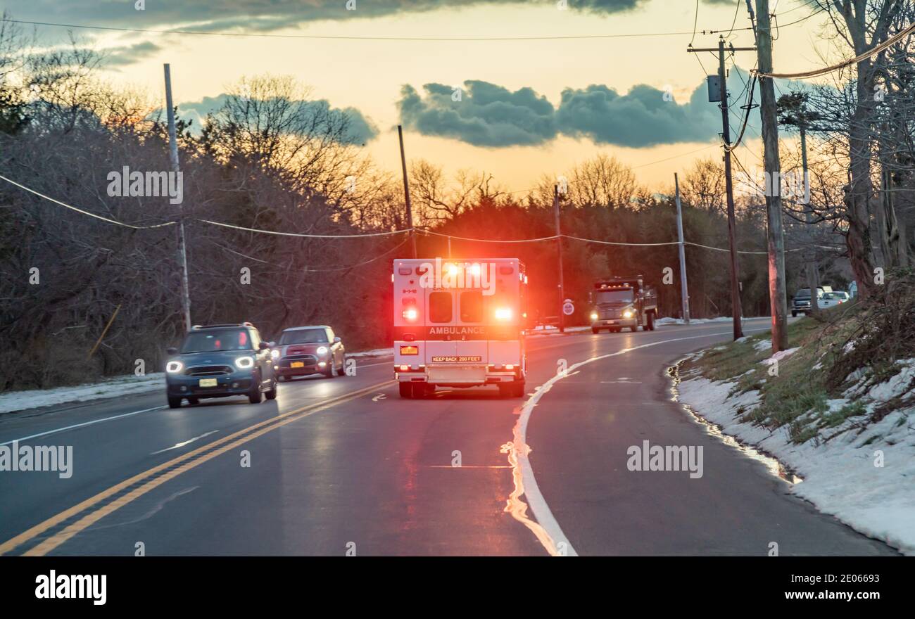 East Hampton Ambulance on an emergency run with lights and siren on Stock Photo