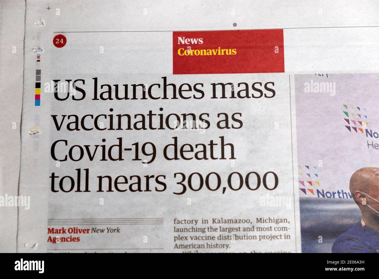 Guardian newspaper headline Covid 19 deaths in America USA  'US launches mass vaccinations as Covid-19 death toll nears 300,000'  14 December 2020 UK Stock Photo