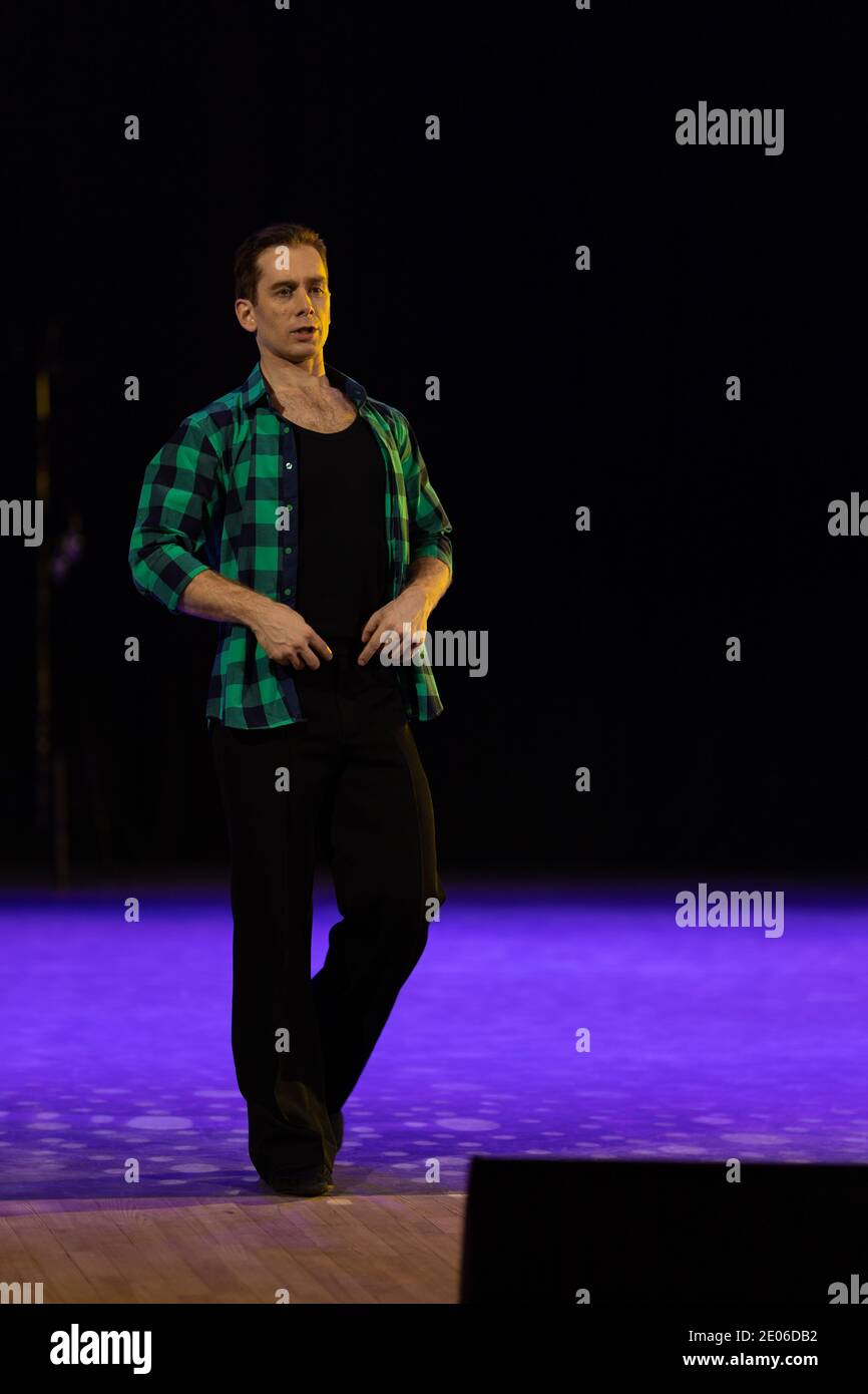 Actor dancer young man performs in the theater on stage in a dance ...