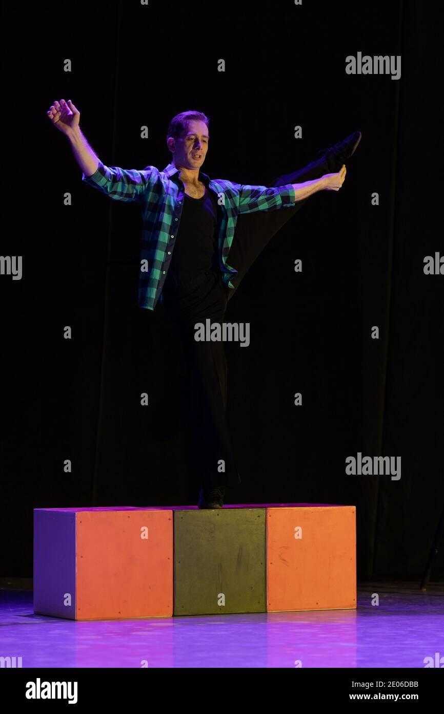 Actor dancer young man performs in the theater on stage in a dance ...