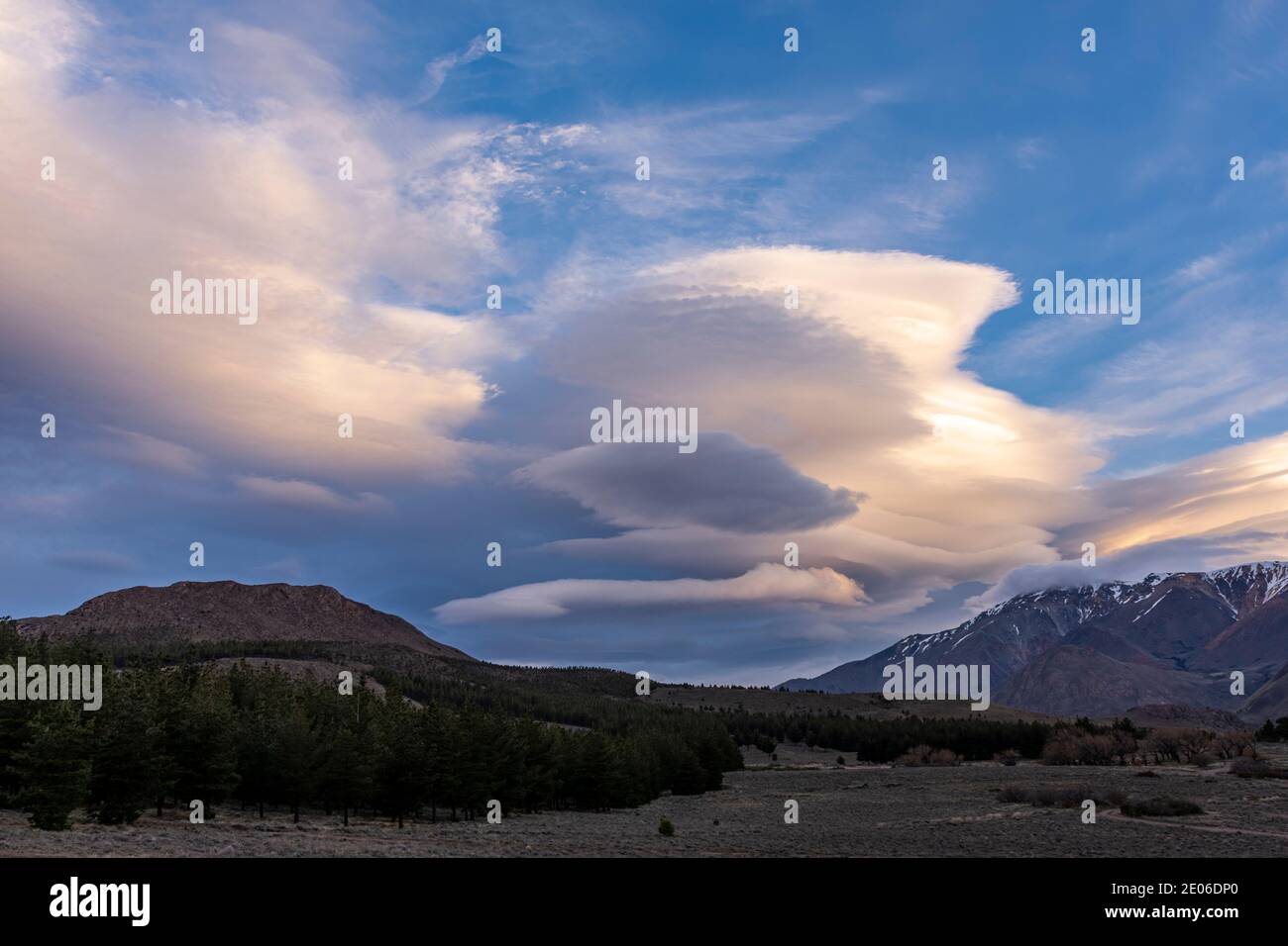 Lenticular clouds formation over the mountains during sunset in Esquel, Patagonia, Argentina Stock Photo