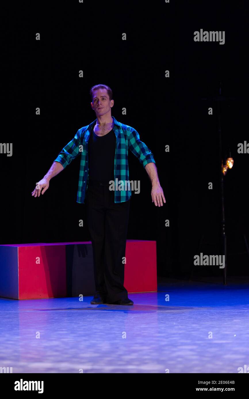 Actor dancer young man performs in the theater on stage in a dance ...