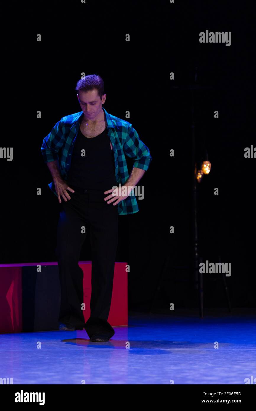 Actor dancer young man performs in the theater on stage in a dance ...