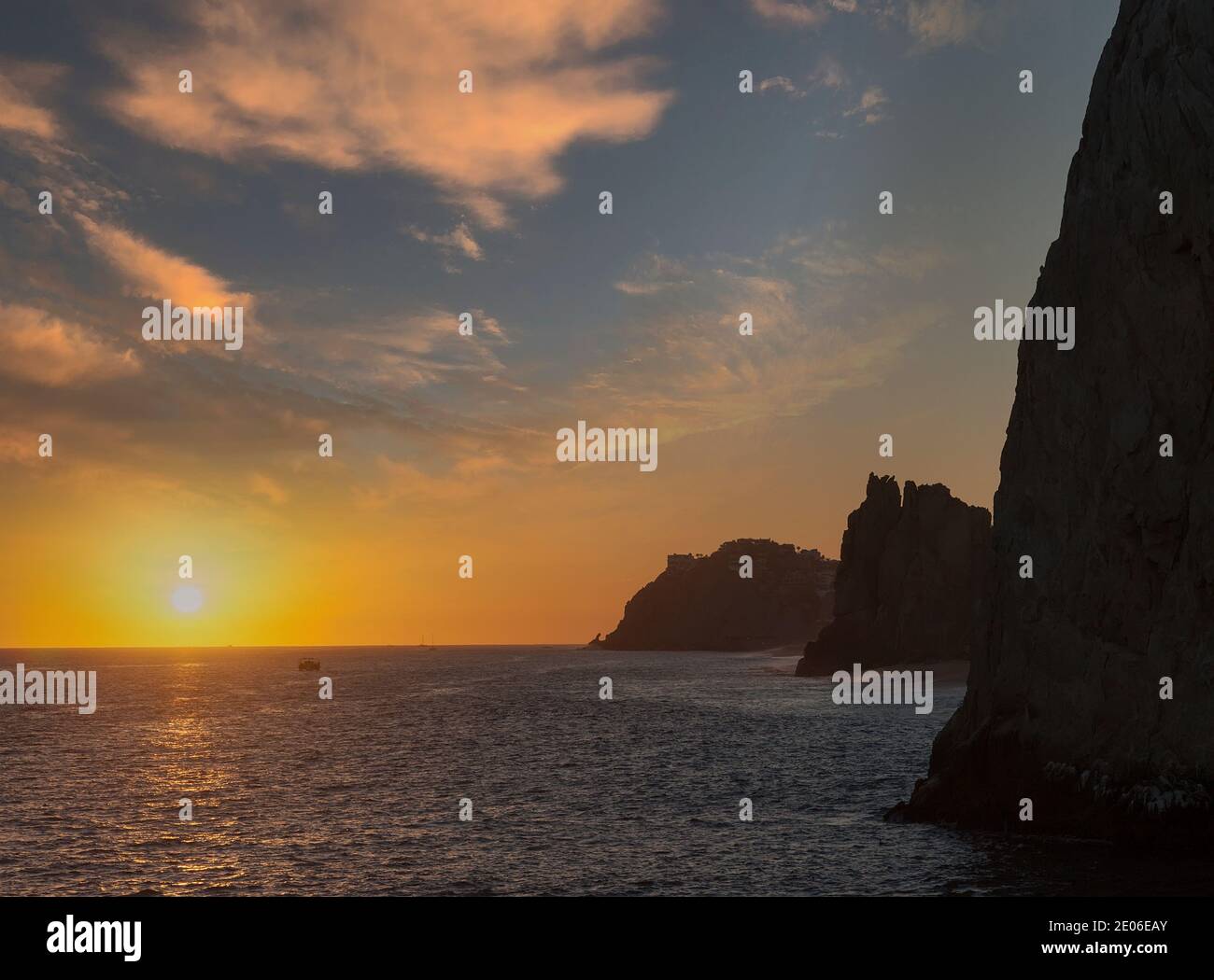 Sun setting over the Sea of Cortez at Lands End in Cabo San Lucas, Mexico Stock Photo