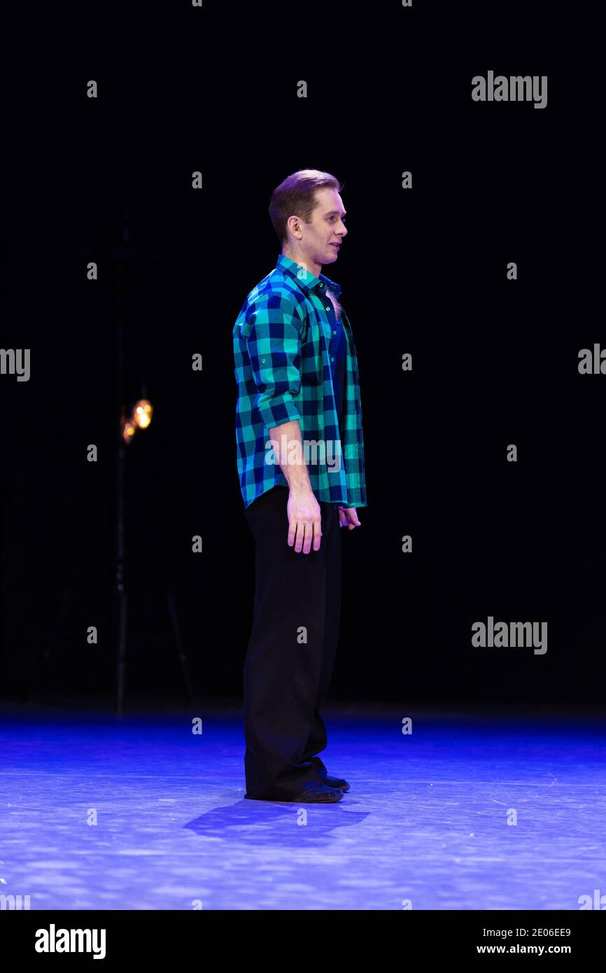 Actor dancer young man performs in the theater on stage in a dance ...