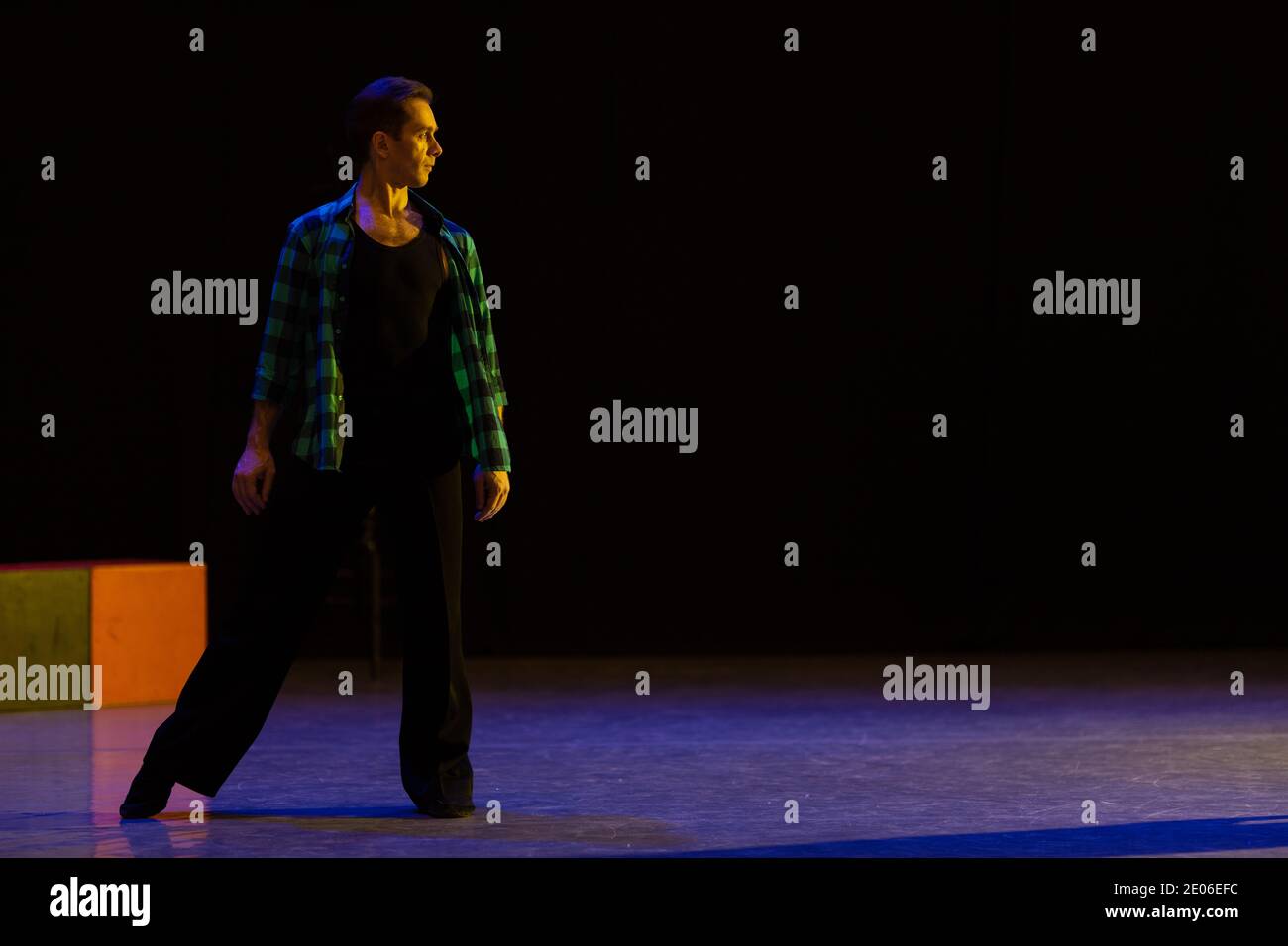 Actor dancer young man performs in the theater on stage in a dance ...