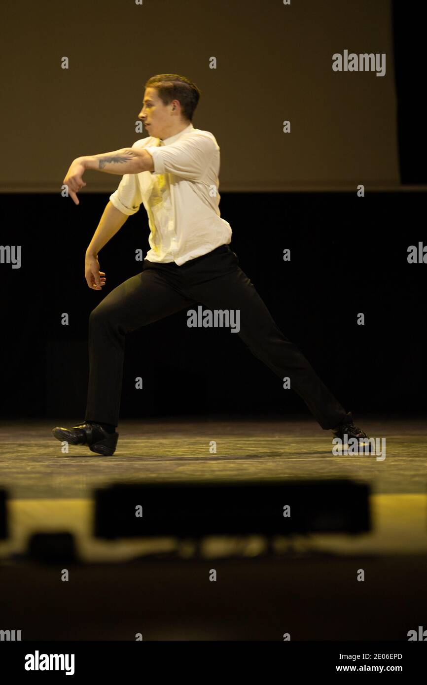 Actor dancer young man performs in the theater on stage in a dance ...