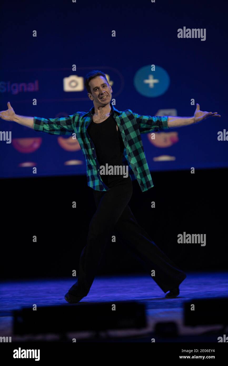 Actor dancer young man performs in the theater on stage in a dance ...
