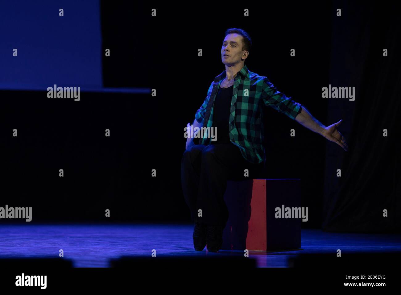 Actor dancer young man performs in the theater on stage in a dance ...
