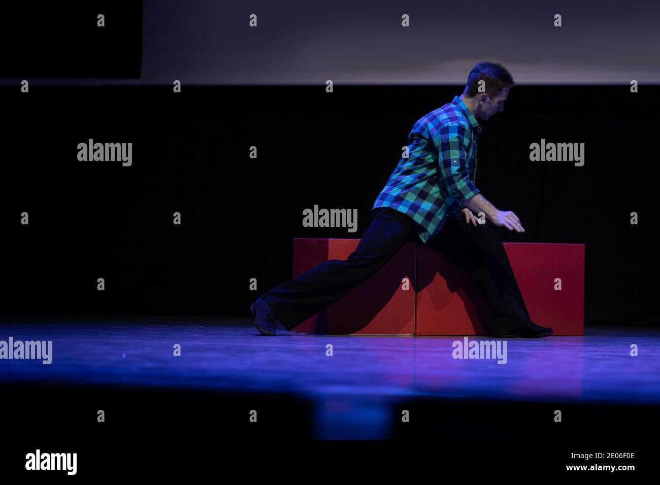 Actor dancer young man performs in the theater on stage in a dance ...
