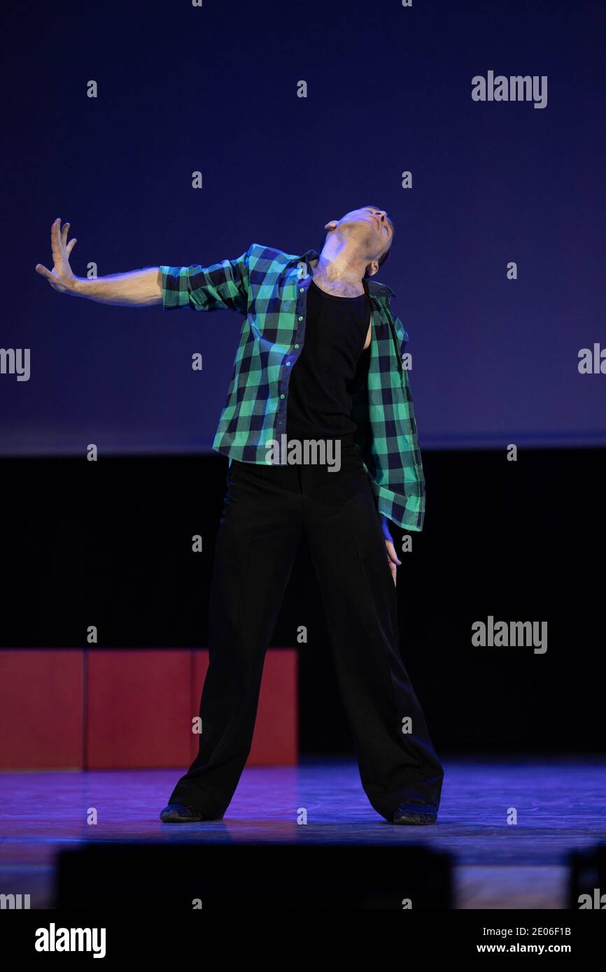 Actor dancer young man performs in the theater on stage in a dance ...