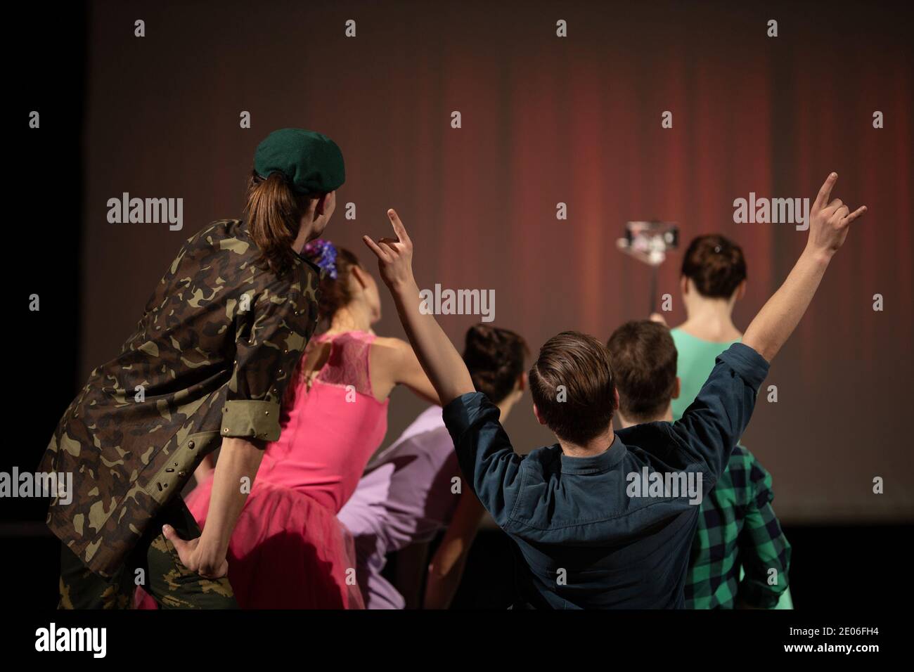 Team Actors dancers perform in the theater on stage in a retro musical ...