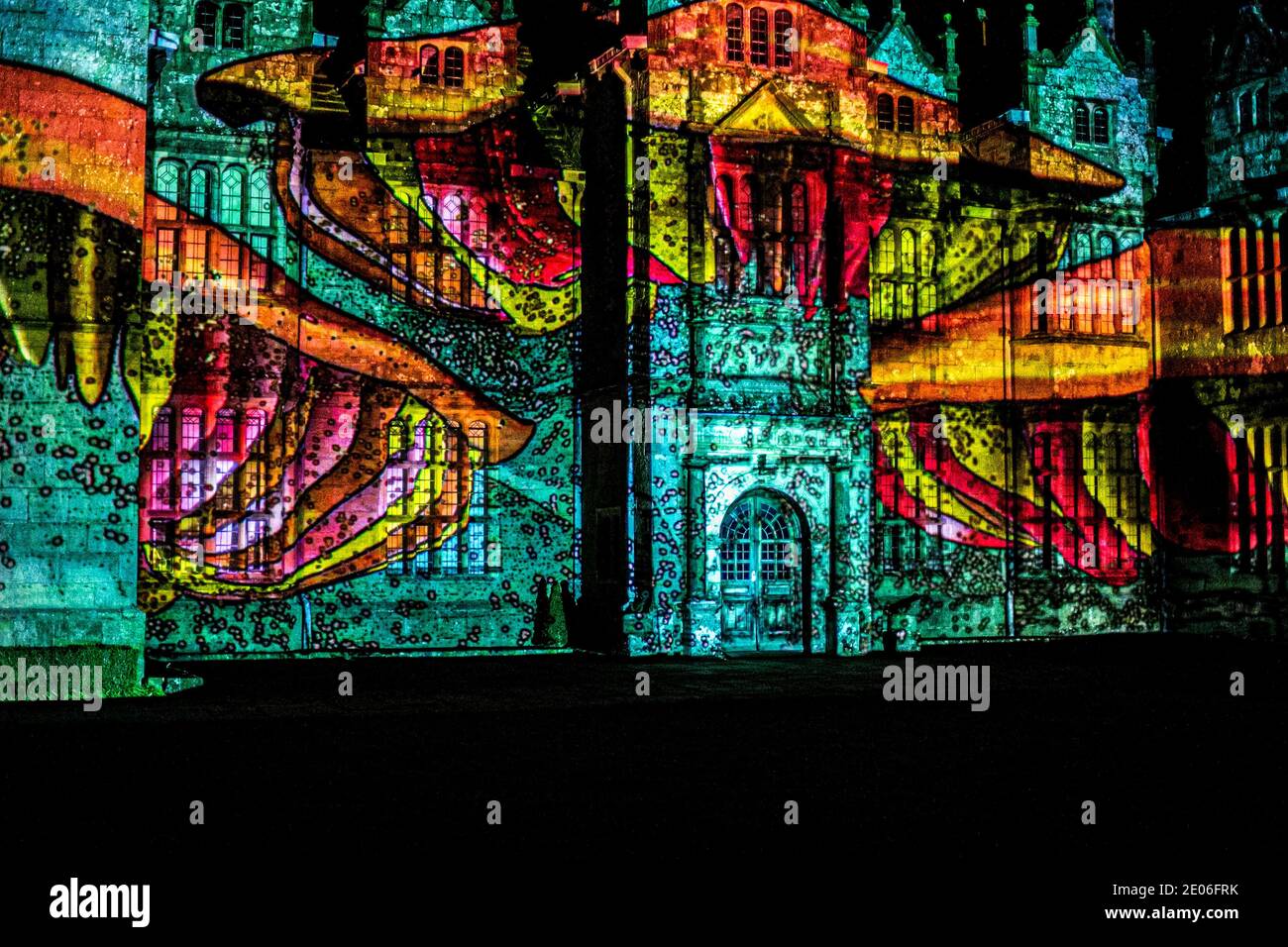 December 29, 2020: Haywards Heath, UK. 29 December 2020. Christmas light trail 'Glow Wild 2020'' livens up this year's festivities at Wakehurst Place Botanic Gardens, in West Sussex. In the evening the trail lights up and brings to life Wakehurst botanic gardens and its 16th century mansion with its enchanting atmosphere created by glowing lanterns, torches of fire, and enthralling projections. Now in its seventh year, 'Glow Wild'' has gone ahead this year despite the pandemic, by maintaining rigorous safety protocols in line with the latest government guidance on illuminated trails. A n Stock Photo