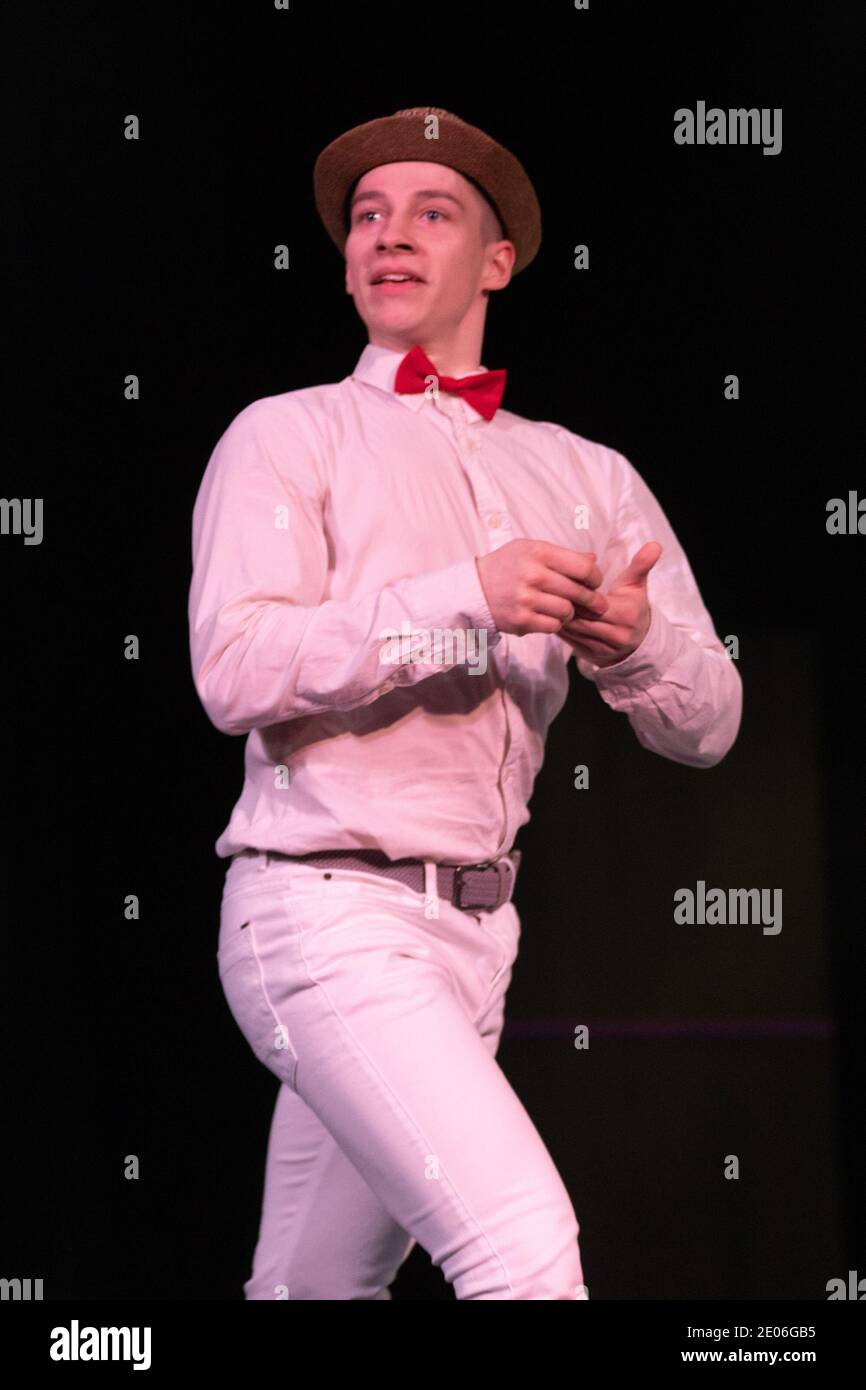 Actor dancer young man performs in the theater on stage in a retro ...